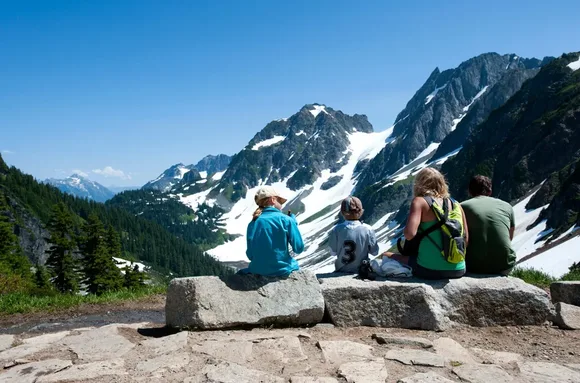 Family resting together at Cascade Pass